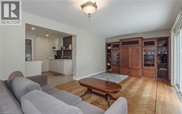 Brampton house for rent - A living room with a grey couch and a wooden coffee table.