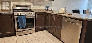 Cambridge townhouse for rent - A kitchen with a stove and a dishwasher.