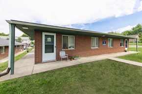 Ann Arbor apartment for rent - the front of a brick house with a porch