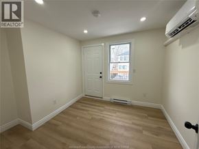 Windsor apartment for rent - A room with a door and a window.