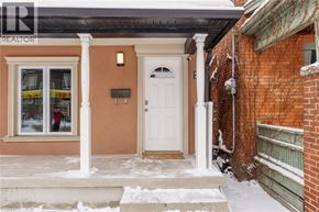 Hamilton house for rent - A house with a brown wall and a white door is shown.
