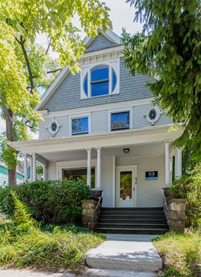 Ann Arbor house for rent - a house with a blue roof and a porch
