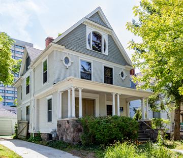 Ann Arbor house for rent - an old house with a sidewalk in front of it