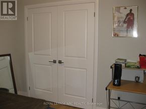 Niagara Falls (Morrison) condo for rent - A white double door with a black handle.