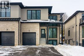 Rockwood house for rent - A modern house with a black garage door is for sale.