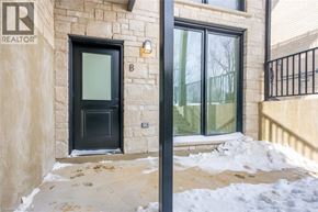 Rockwood house for rent - A black door with a glass window is on a tan wall.