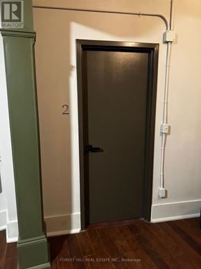 For rent in Belleville (Belleville Ward) - A door with a number 2 on it is in a hallway.