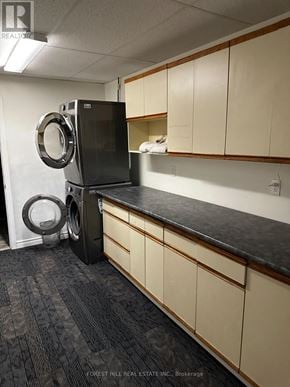For rent in Belleville (Belleville Ward) - A black fridge and washing machine in a kitchen.