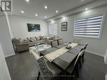 Innisfil (Alcona) house for rent - A well-lit, spacious living room with a dining table and chairs.