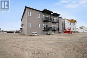 For rent in Russell - A building with the text EXP REALTY, Brokerage in front of it.