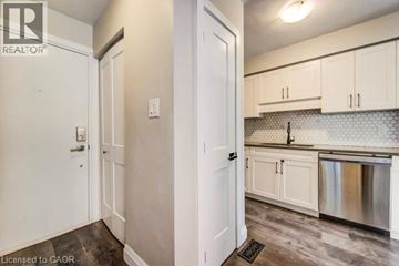 Cambridge apartment for rent - A kitchen with white cabinets and a stainless steel dishwasher.