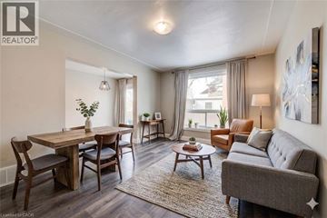 Cambridge apartment for rent - A well-lit living room with a dining table and chairs.