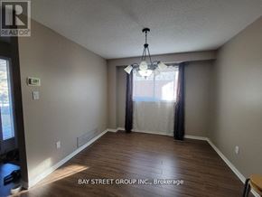 Mississauga (Erin Mills) house for rent - A room with a window and a curtain with the text Bay Street Group Inc Brokerage on the wall.