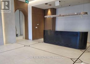 Ottawa condo for rent - A reception area with a blue counter and a wooden door.