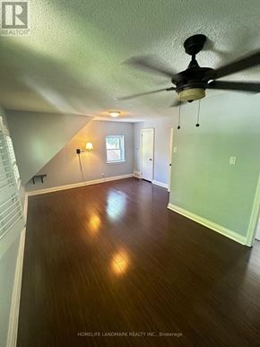 Toronto (Willowdale East) house for rent - A room with a ceiling fan and wooden floors.