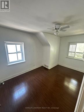 Toronto (Willowdale East) house for rent - A room with wooden floors and a ceiling fan.