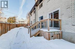 Cambridge townhouse for rent - A snow-covered deck in front of a house.