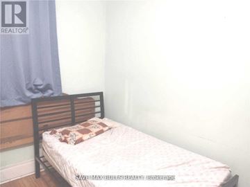 Hamilton (Central) condo for rent - A bedroom with a bed and a pillow on it.