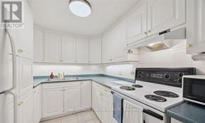 Ajax (Central West) house for rent - A kitchen with white cabinets and a blue backsplash.