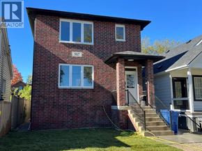 Windsor house for rent - A red brick house with the number 917 on it.
