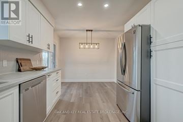 St. Thomas house for rent - A modern kitchen with a refrigerator on the right and a dishwasher on the left.