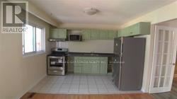 Mississauga (Erin Mills) other for rent - A kitchen with white appliances and a white refrigerator.
