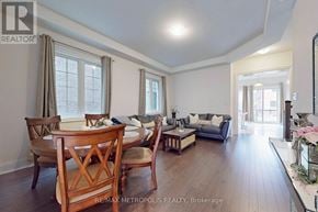 Vaughan (Vellore Village) house for rent - A well-lit living room with a dining table and chairs.