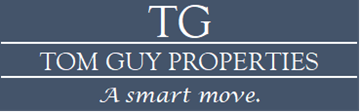 Tupelo apartment for rent - A blue sign with the letters TG and the words Tom Guy Properties and A smart move.