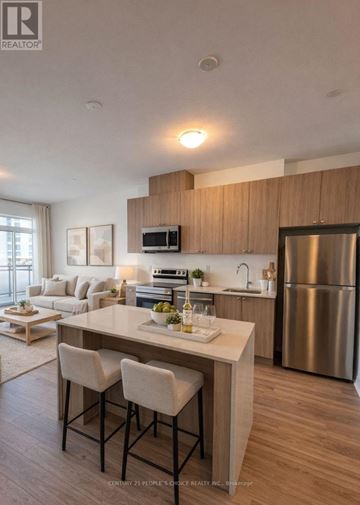 Milton (Walker) condo for rent - A modern kitchen with a dining table and chairs.