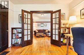 Toronto (Birchcliffe-Cliffside) house for rent - A living room with a couch, a chair, and a bookshelf.