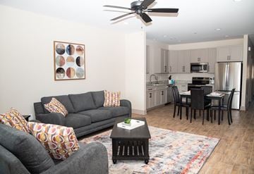 Florence apartment for rent - A modern living room with a grey couch and a coffee table.