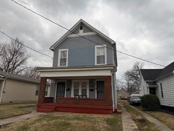 Louisville apartment for rent - A blue house with a red front porch.