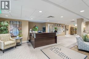 St Clair apartment for rent - A well-lit office lobby with a reception desk and comfortable seating.