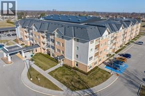 St Clair apartment for rent - A large apartment complex with a parking lot in front.