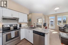St Clair apartment for rent - A modern kitchen with a stove top oven and a dishwasher.
