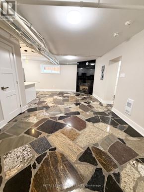 Ottawa apartment for rent - A tile floor with a mix of brown and black tiles.