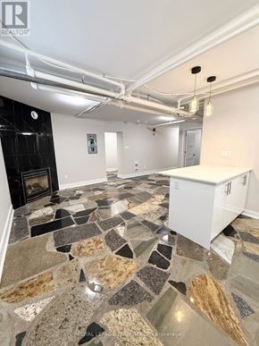 Ottawa apartment for rent - A kitchen with a stone floor and a white cabinet.