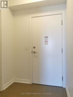 Richmond Hill (Langstaff) condo for rent - A white door with a sign on it in a room.