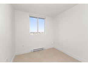 Langley apartment for rent - Children playing with toys in a playroom with a mural of mountains on the wall.