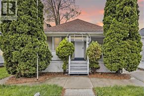 Windsor apartment for rent - A house with a front yard and a tree in front of it.