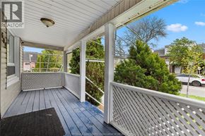 Windsor apartment for rent - A porch with a white railing and a black mat.