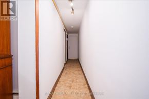 Toronto (East End-Danforth) duplex for rent - A long hallway with a door at the end.