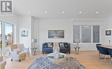 Toronto (Clairlea-Birchmount) apartment for rent - A living room with a large rug and a fireplace.