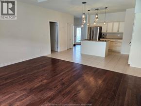 Windsor townhouse for rent - A spacious kitchen with a white island and wooden floors.