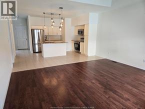 Windsor townhouse for rent - A kitchen with a refrigerator, sink, and oven.