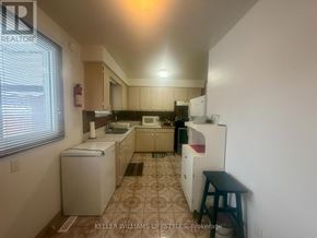 London North (North K) apartment for rent - A small kitchen with a washer and dryer.