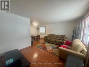 London North (North K) apartment for rent - A living room with a couch, chairs, and a rug.