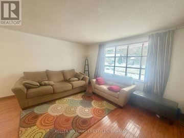 London North (North K) apartment for rent - A living room with a couch and a chair.