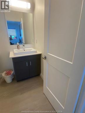 Lasalle apartment for rent - A bathroom with a sink, mirror, and cabinet.