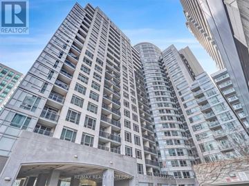 Toronto (Waterfront Communities) condo for rent - A living room with a grey couch, a white coffee table, and a painting on the wall.